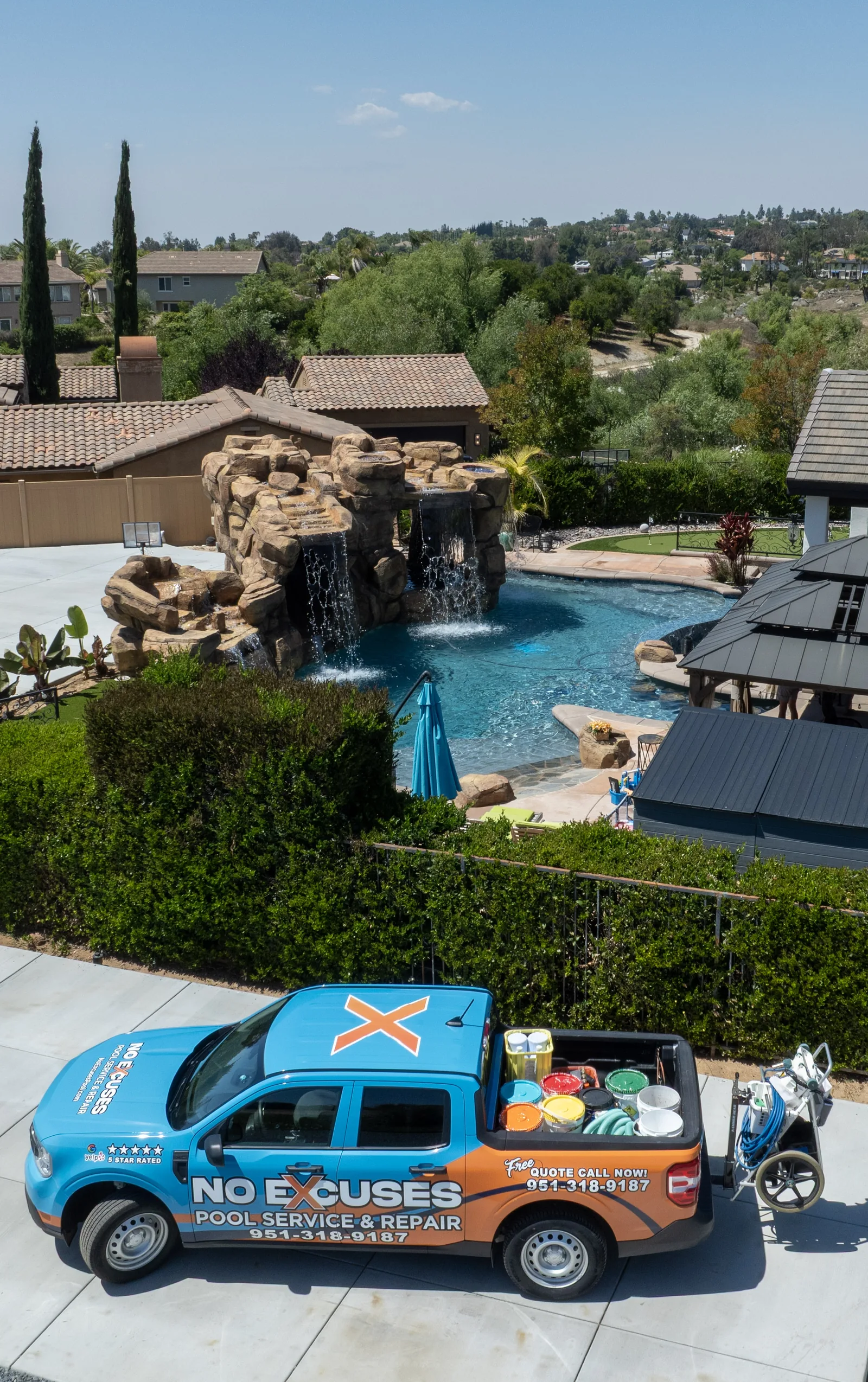 No Excuses Pool Service truck at luxury pool aerial shot Riverside CA