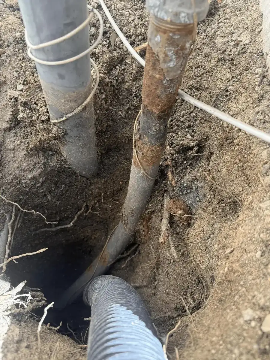 Excavated corroded galvanized gas line underground
