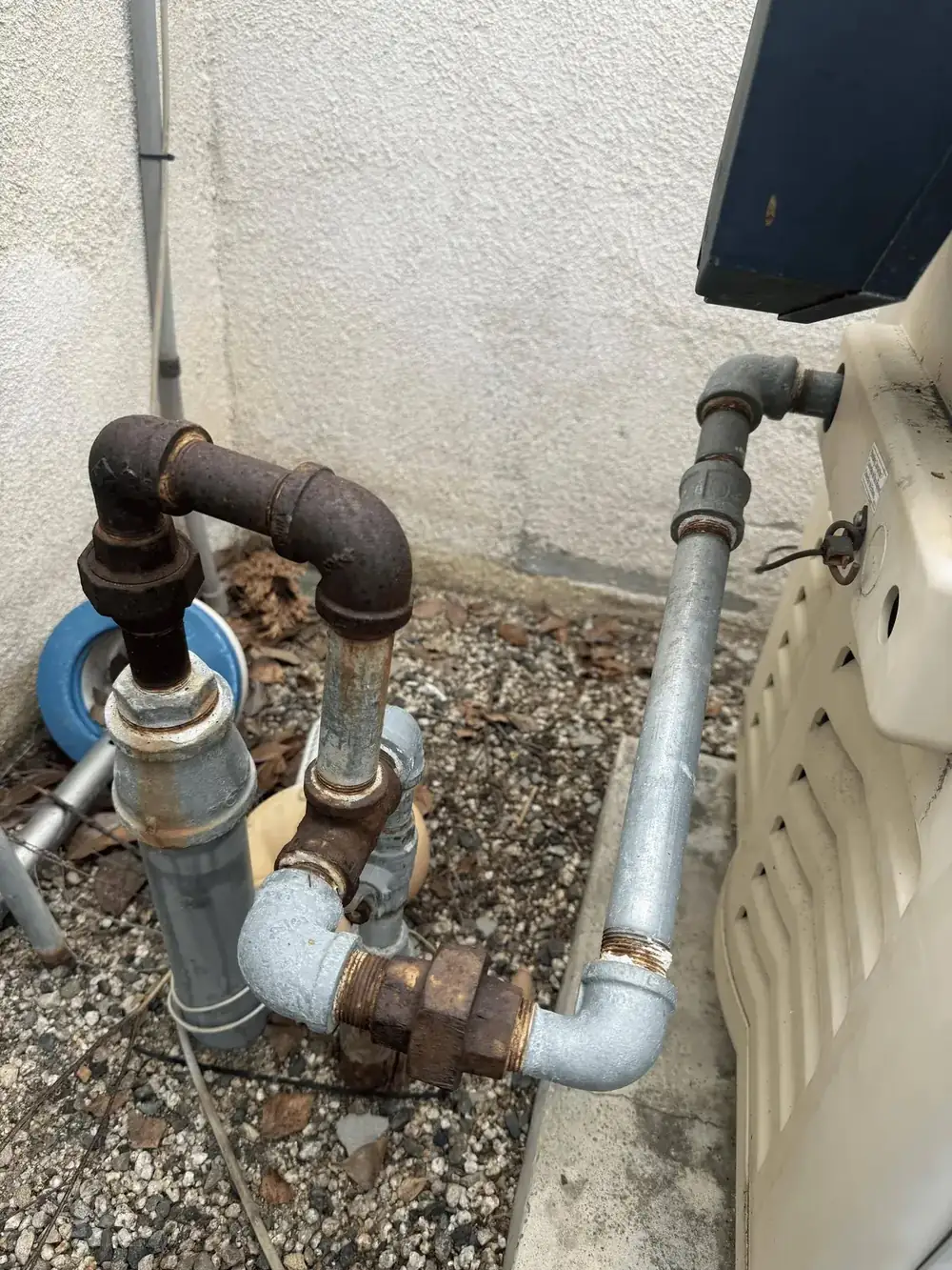 Old corroded galvanized gas line at pool equipment pad